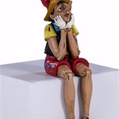 Antiqued Sitting Pinocchio Figure