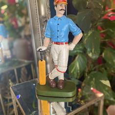 Cast iron antiqued cricketer door stop 