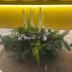 White and silver table arrangement with candles 
