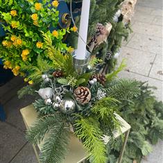 Silver table centrepiece with candle 